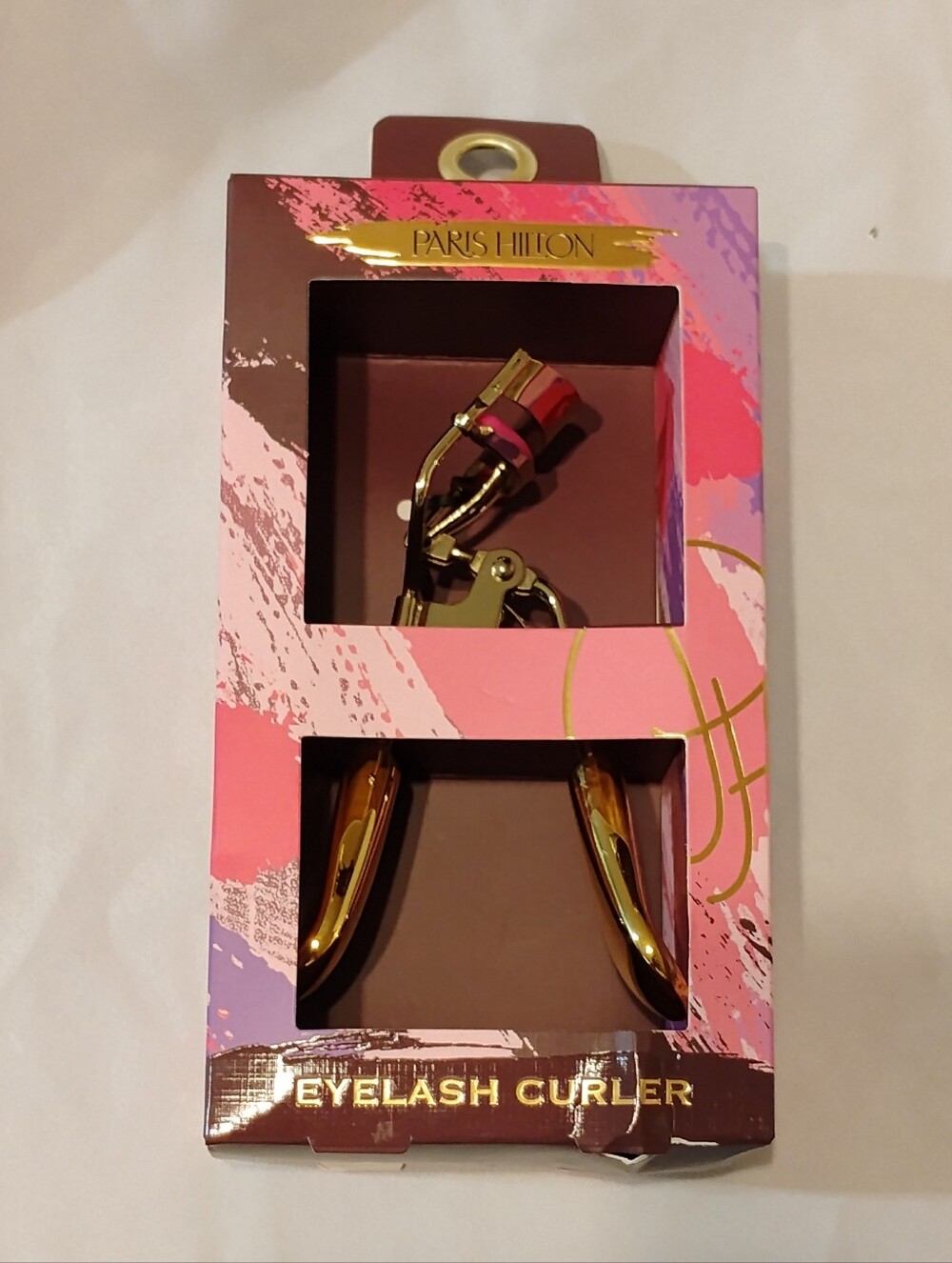 Paris Hilton Gold Eyelash Curler with Pink Accent